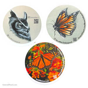 The Wildlife Sticker Pack includes three round stickers: an owl sketch with piercing eyes, a monarch butterfly on gray, and a monarch butterfly amidst red and orange flowers. Each features QR codes and artist credits.