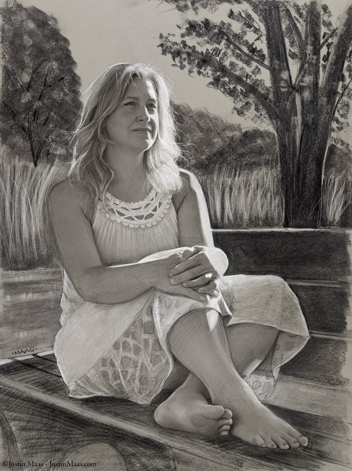 A woman in a light dress sits barefoot on outdoor steps, hands clasped around her knees, smiling softly. Behind her are tall grasses and leafy trees. The image is in black and white, with detailed pencil shading.